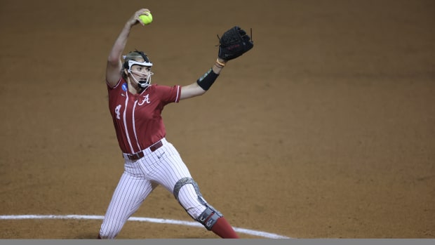 Montana Fouts pitching with knee brace
